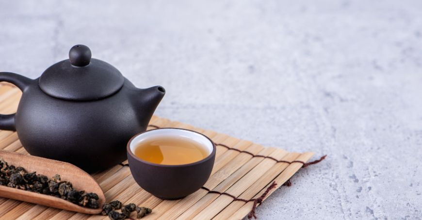 teapot and cup of black tea